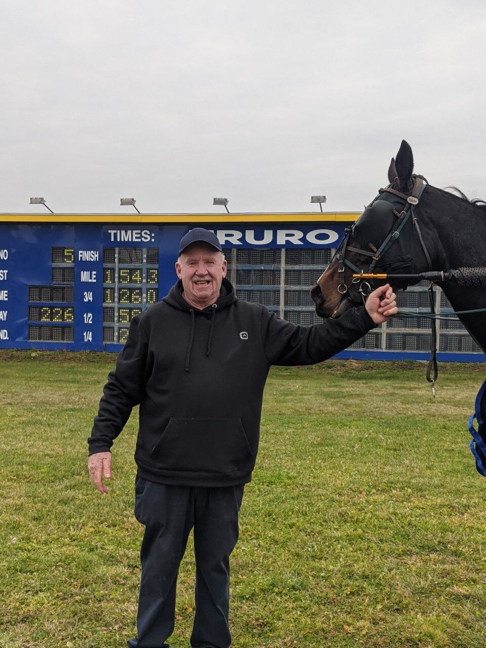 Owner Reg MacPherson with track record holder Woodmere Skyroller